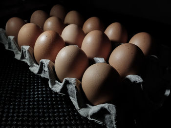 High angle view of eggs in carton