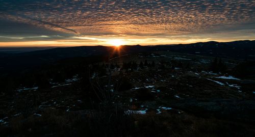 Scenic view of landscape against sky during sunset