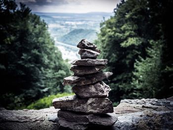 Stack of stones on rock in forest