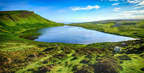 Scenic view of mountain against cloudy sky