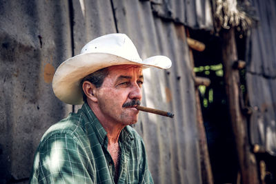 Portrait of man smoking cigarette