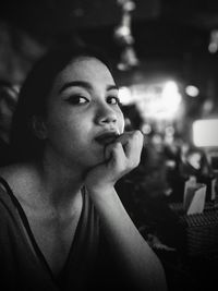 Close-up portrait of young woman looking away