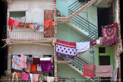 Low angle view of clothes drying outside building