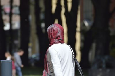 Woman in headscarf walking outdoors