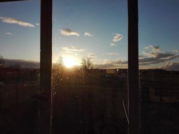 Sunset seen through glass window