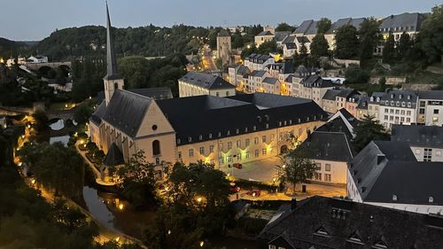 High angle view of illuminated buildings in city