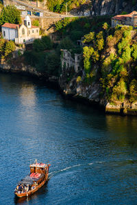 Boat in river by building