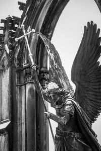 Low angle view of statue against sky