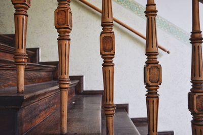 Close-up of wooden staircase railing