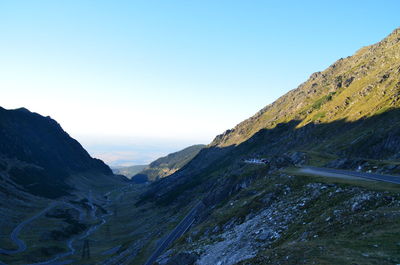 Scenic view of mountains against clear blue sky