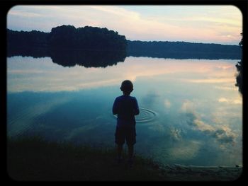 Scenic view of lake at sunset