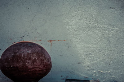 Close-up of fruit against wall