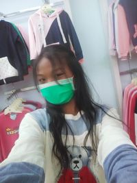 Portrait of a young woman sitting outdoors