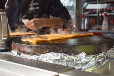 Close-up of man preparing food