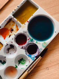 High angle view of paintbrushes on table