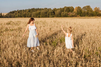 Friends standing on field