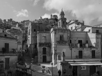 View of buildings in city against sky