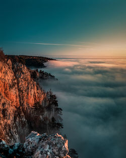 Scenic view of rock formation against sky during sunset