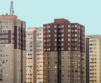 Low angle view of buildings against clear sky