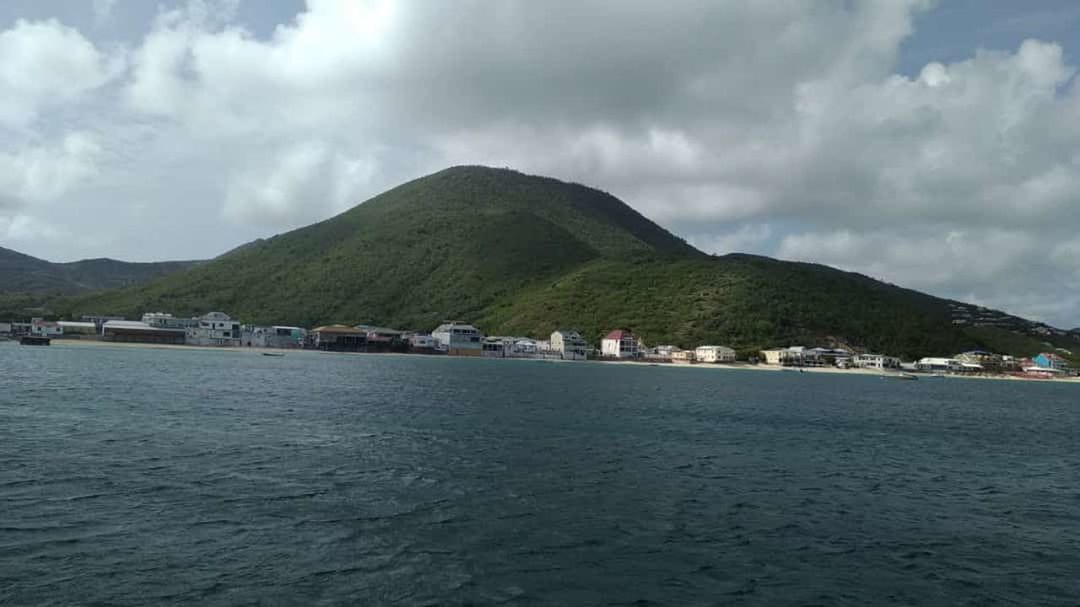 mountain, water, cloud - sky, sky, scenics - nature, sea, waterfront, beauty in nature, architecture, day, nature, built structure, tranquil scene, tranquility, building exterior, mountain range, land, transportation, nautical vessel, no people, outdoors