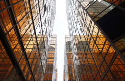 Low angle view of modern buildings against sky