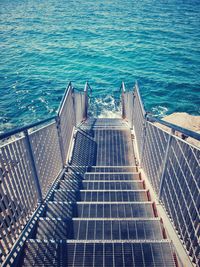 High angle view of stairs to sea