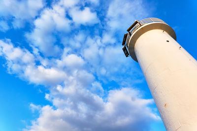 Low angle view of building against cloudy sky