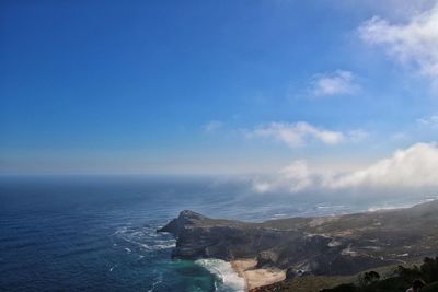 Scenic view of sea against blue sky