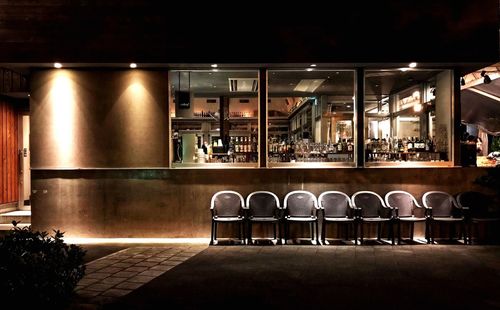 Empty chairs and tables in restaurant