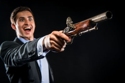 Close-up of a hand holding old gun