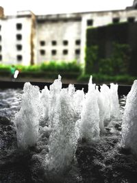 Water splashing in sea against built structures