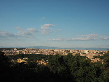 Aerial view of townscape against sky