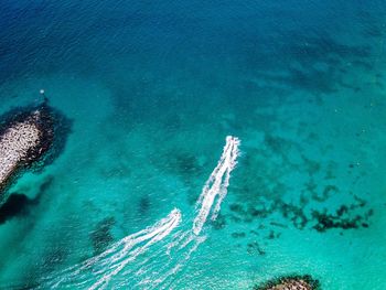 High angle view of sea against blue sky