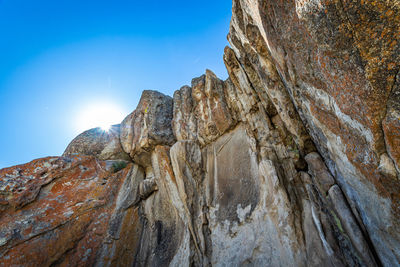 Low angle view of rock formation against sky