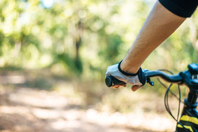 Close-up of man riding bicycle