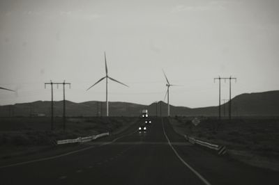 Road by landscape against sky