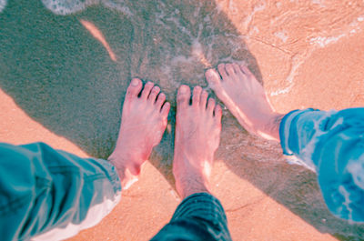 Low section of people standing in water