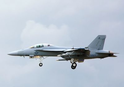 Low angle view of airplane flying in sky