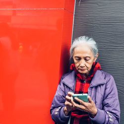 Portrait of young man using mobile phone