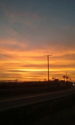 Scenic view of road at sunset