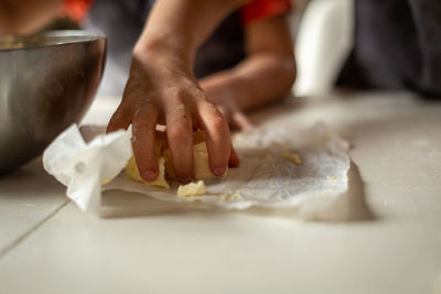 Midsection of person preparing food