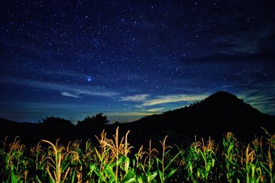 Scenic view of silhouette mountain against sky at night
