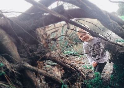 Full length of young man in forest