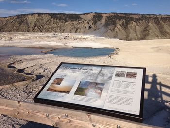 Picture frame by railing against mountain at yellowstone national park