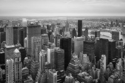 Aerial view of modern buildings in city against sky