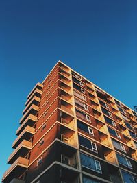 Low angle view of building against clear blue sky