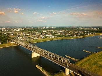 High angle view of bridge over river against cloudy sky