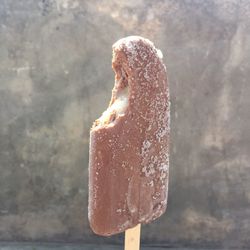 Close-up of ice cream against wall