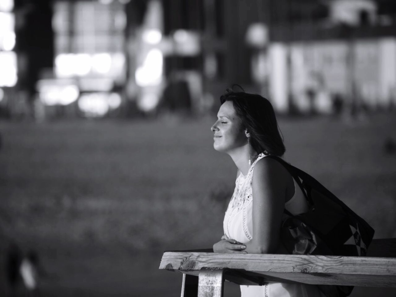 sitting, one person, bench, only women, young adult, one woman only, people, adults only, adult, outdoors, day