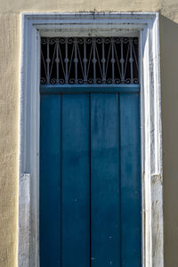 Closed blue door of building